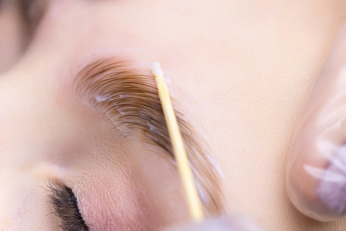 Eyebrow lamination performed on woman's eyebrow